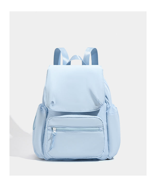 Soft matte nylon flap backpack with front zip pocket and side drawcord pockets, detail view 15