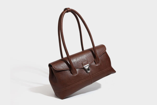 Structured rectangular satchel bag with dual rounded top handles and central metal turn-lock flap closure, detail view 21