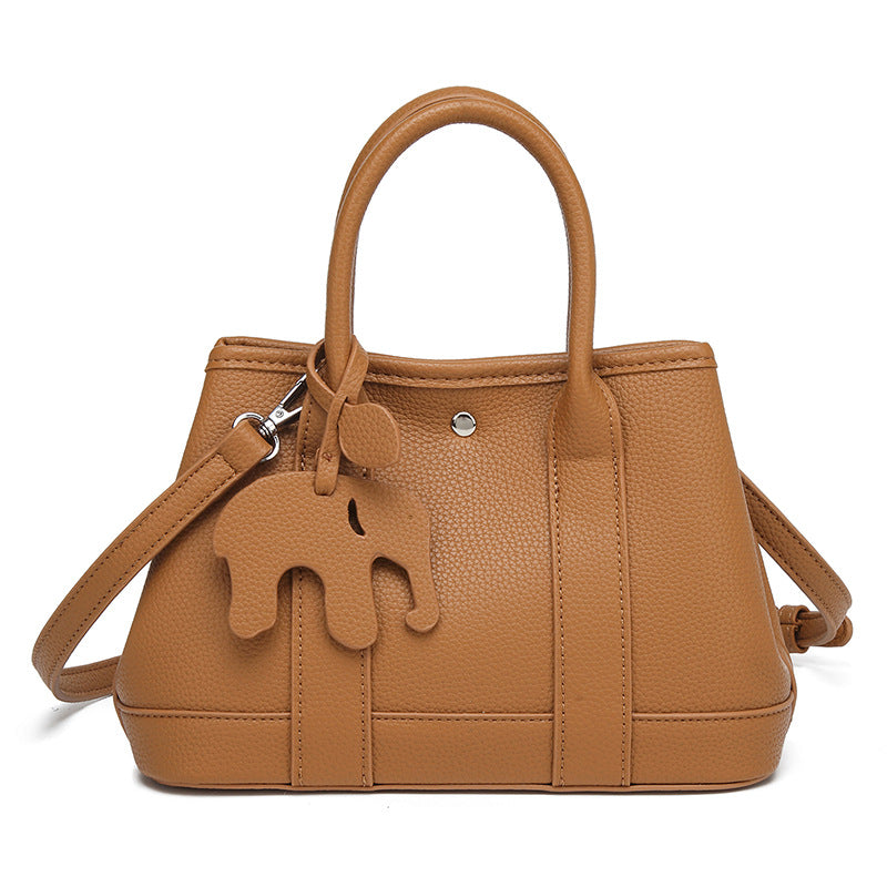 Structured pebbled leather-look top-handle tote bag with elephant charm and detachable shoulder strap, detail view 10