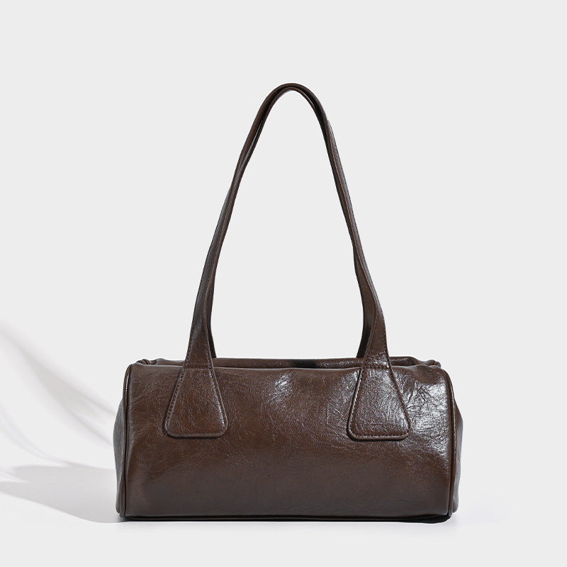 Glossy leather-look barrel shoulder bag with zip closure and top handles, detail view 6