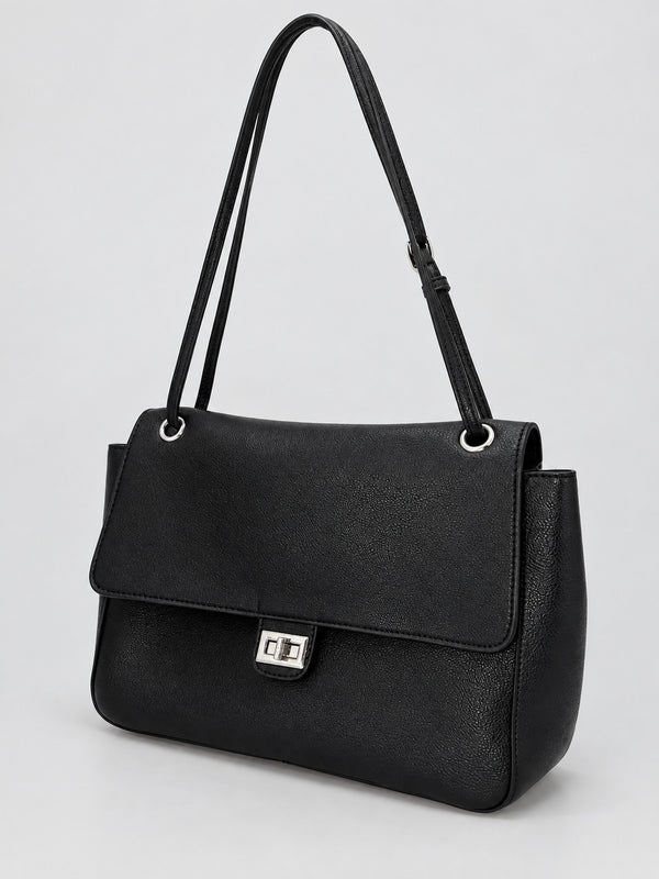 Structured black flap shoulder bag with pebbled texture, silver-tone turn-lock closure, and adjustable single shoulder strap