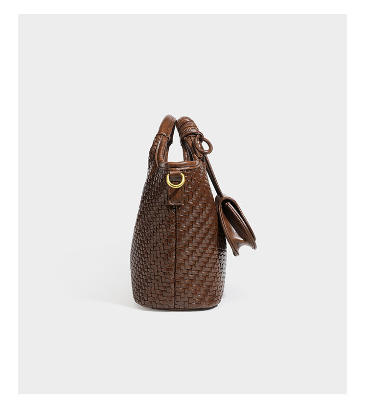 Woven leather-look tote bag in mocha brown with knotted top handle, front flap pocket, and detachable crossbody strap with