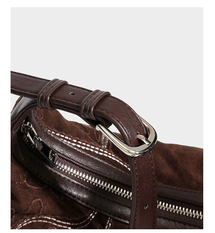 Deep chocolate suede-look hobo shoulder bag with tonal paisley floral embroidery, smooth dark leather-look trim, top zip