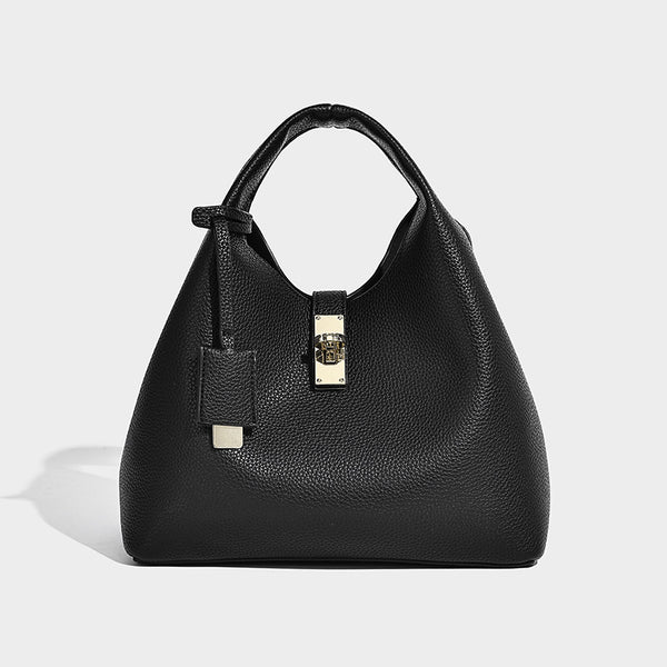 Structured pebbled-texture bucket bag with arched top handles, gold-tone turn-lock closure, and detachable shoulder strap