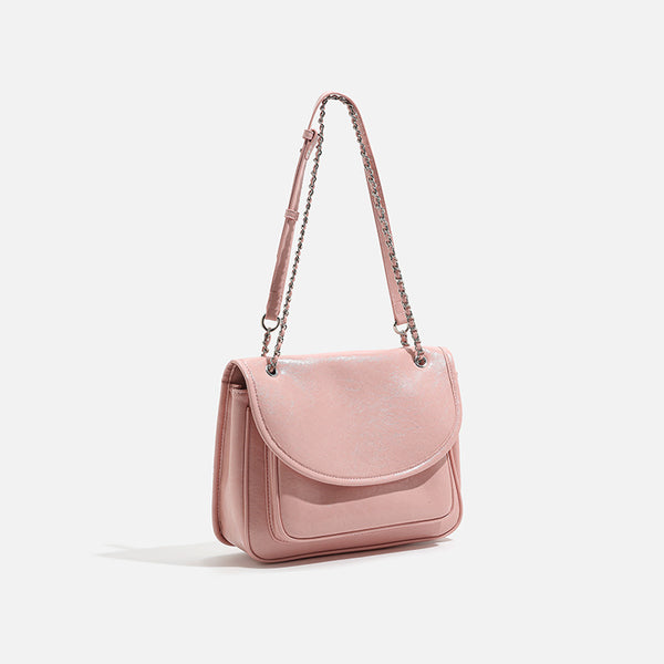Structured glossy leather-look flap crossbody satchel with woven chain-and-leather shoulder strap, detail view 2