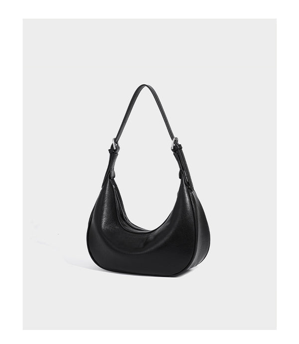 Crescent half-moon shoulder bag in pebbled leather-look finish with adjustable strap and silver-tone hardware, detail view 12