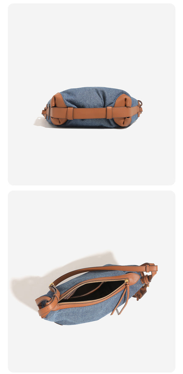 Washed denim canvas crescent hobo bag with tan leather-look trim, knotted strap detail, and gold-tone zipper hardware, detail
