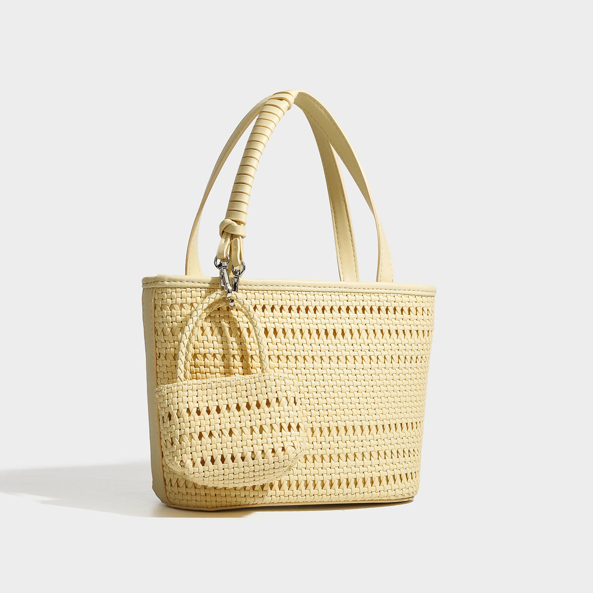Structured open-weave tote bag with smooth leather-look trim, double top handles, detachable crossbody strap, and mini zip