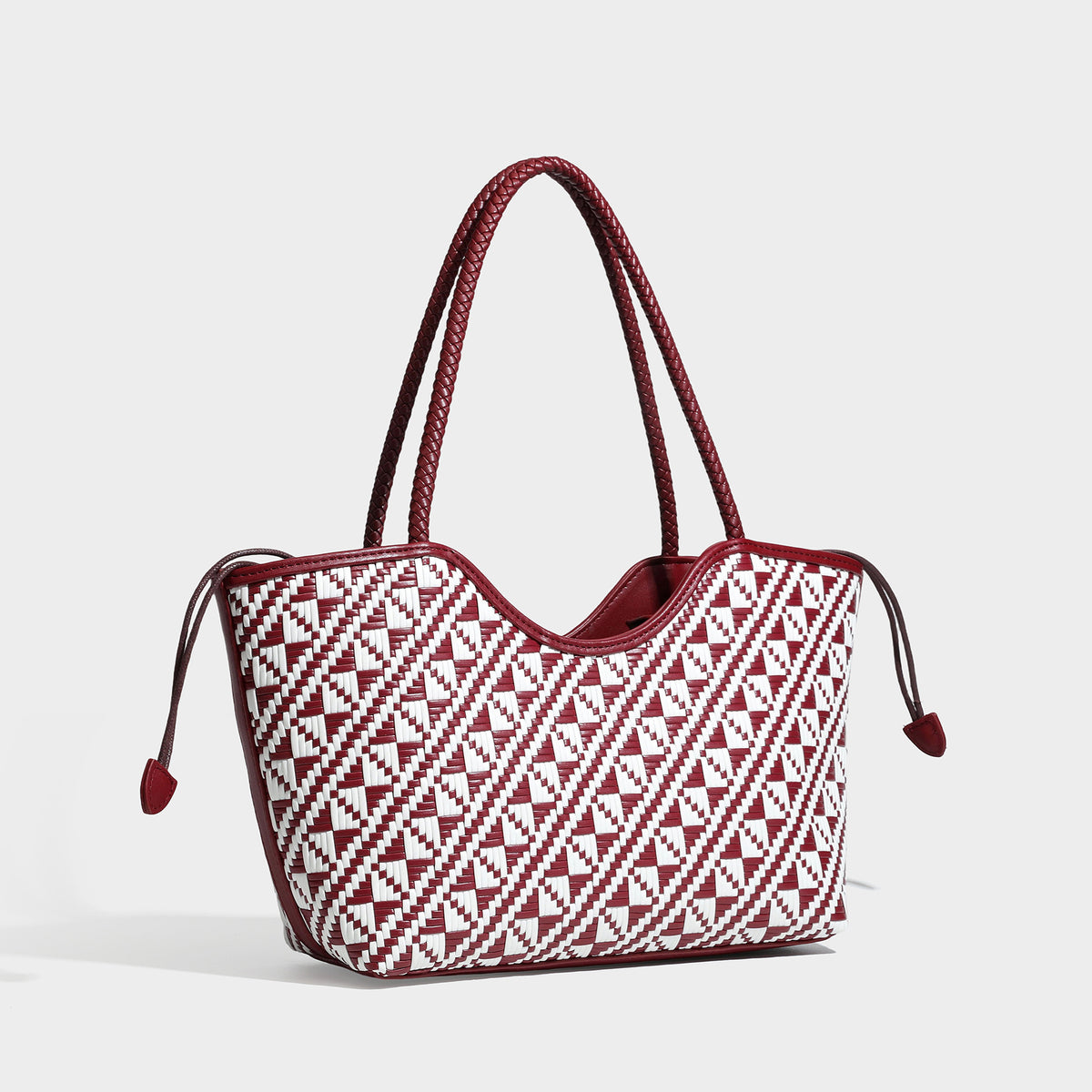 Woven geometric two-tone tote bag with braided shoulder straps and leather-look trim, detail view 4
