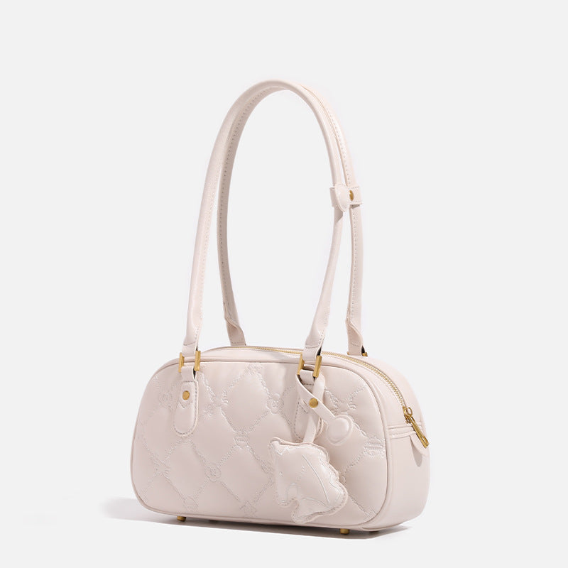 Small structured quilted leather-look zip shoulder bag with gold-tone hardware and adjustable strap, detail view 3