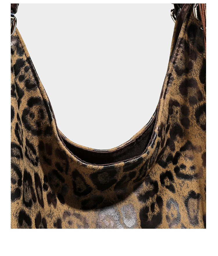 Slouchy leopard-print shoulder tote bag in tan and brown with long double straps, side tie straps, and dangling charm, detail