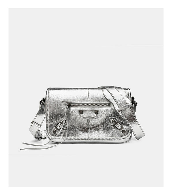 Small structured rectangular crossbody bag with crinkle leather-look finish, front zip pocket, gunmetal stud hardware, and