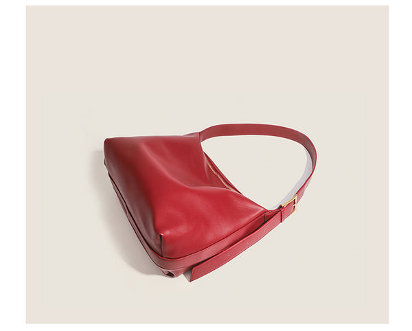 Large slouchy hobo shoulder bag in smooth leather-look finish with single long strap and gold-tone zip closure, detail view