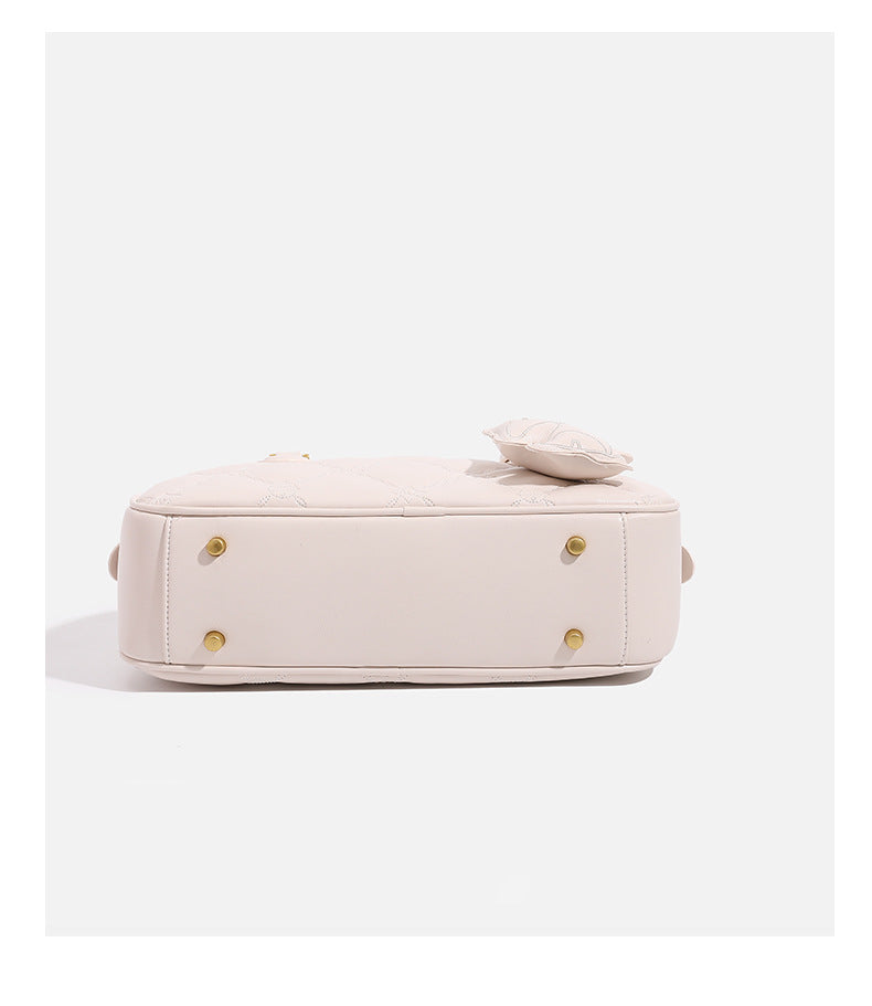 Small structured quilted leather-look zip shoulder bag with gold-tone hardware and adjustable strap, detail view 18