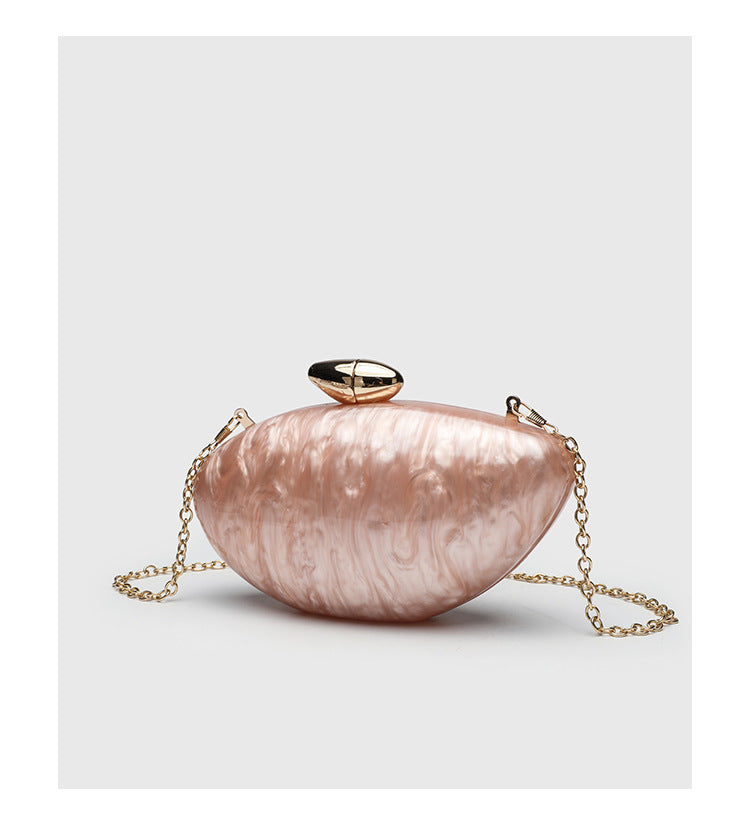 Oval hard-shell marbled gloss clutch bag with gold-tone kiss-lock clasp and detachable gold chain strap, detail view 12