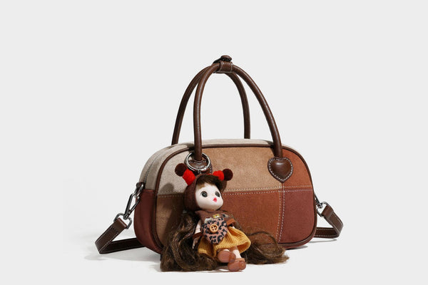 Kleine, strukturierte Henkeltasche aus Patchwork in Farbblöcken aus Beige, Camel, Braun und Rost mit dunkelbrauner Einfassung, herzförmigem