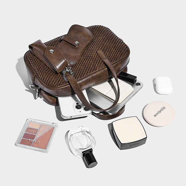Structured woven-texture front top-handle handbag with zip closure, dual handles, detachable shoulder strap, and matching