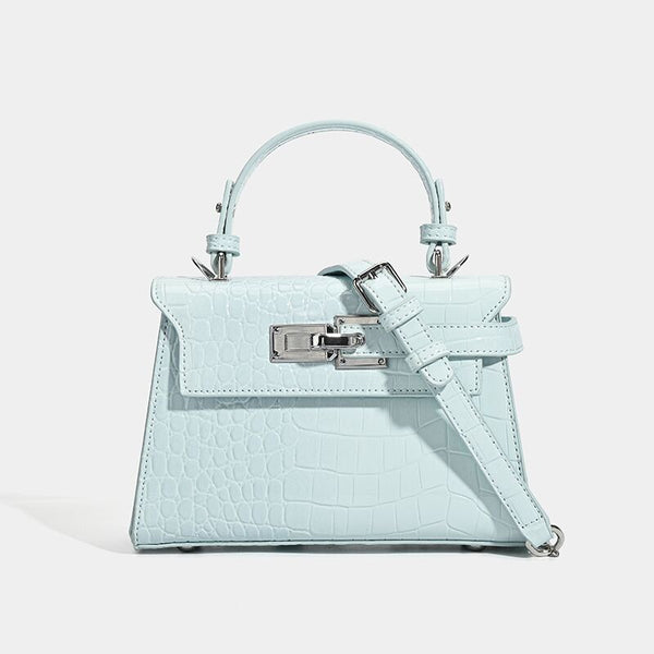 Croc-embossed mini top-handle satchel with silver turn-lock closure and adjustable crossbody strap, detail view 8