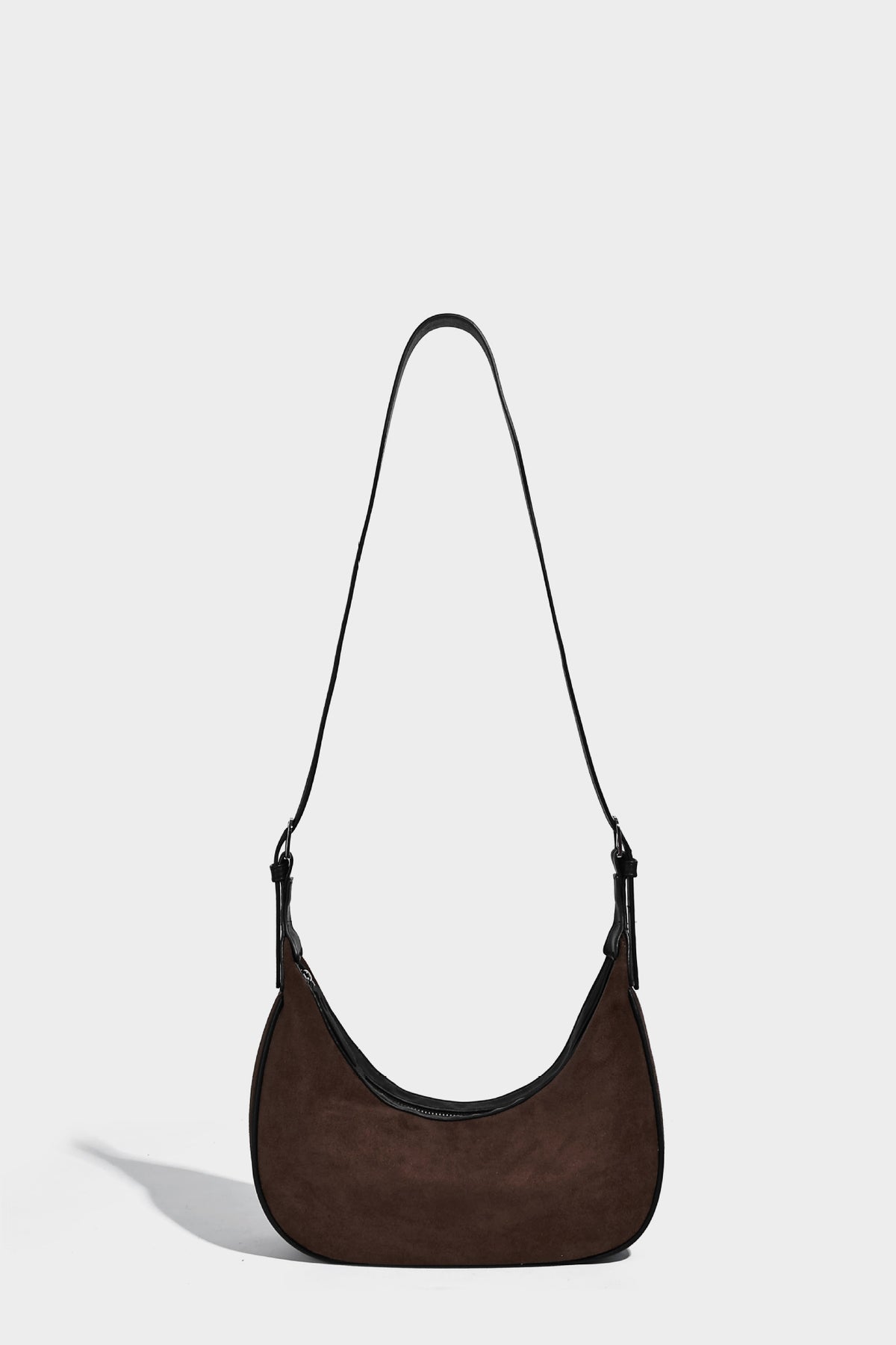 Crescent hobo shoulder bag in matte suede-look finish with black trim and adjustable strap, detail view 17