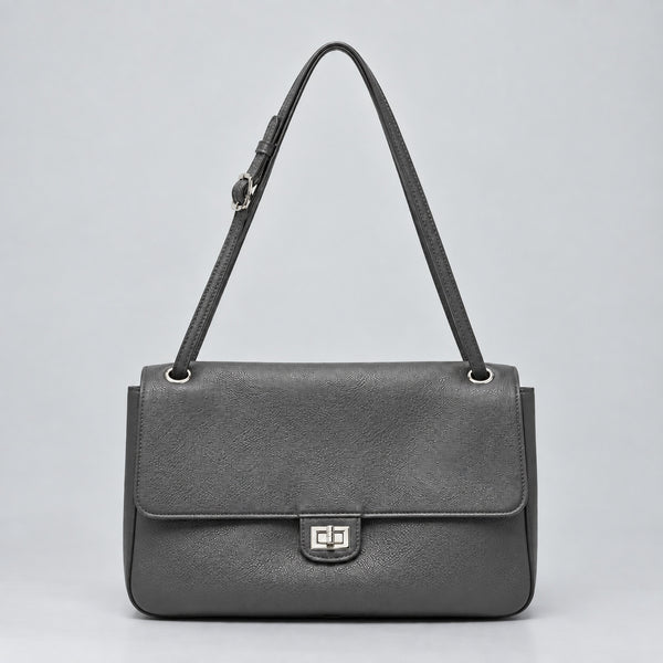 Structured black flap shoulder bag with pebbled texture, silver-tone turn-lock closure, and adjustable single shoulder strap