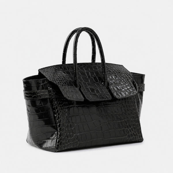 Large structured tote satchel with glossy crocodile-embossed leather-look finish, dual top handles, and metal buckle flap