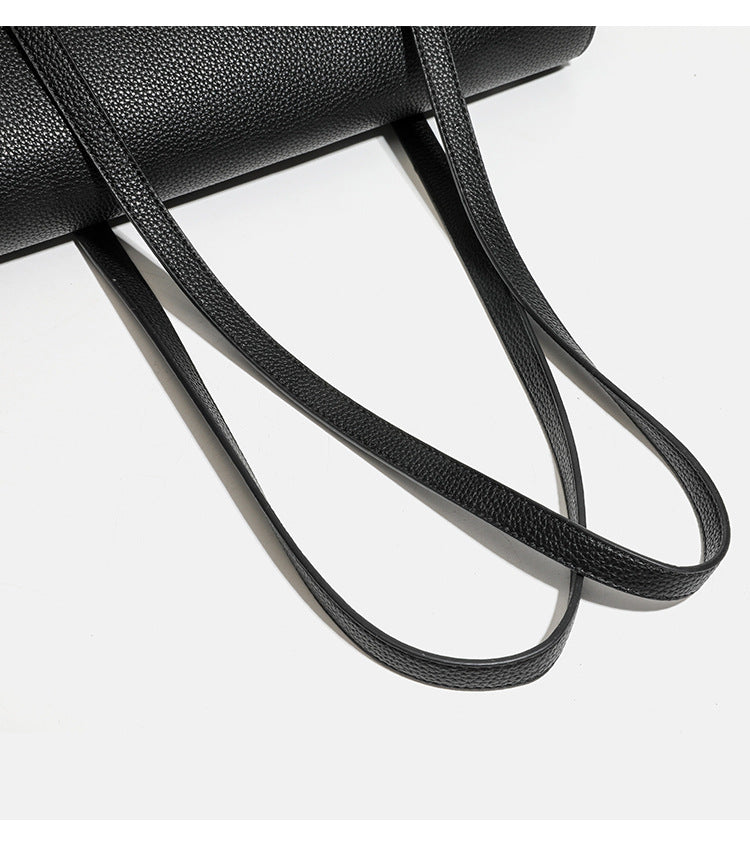 Structured black pebbled-finish flap tote bag with silver turn-lock clasp and long double shoulder straps, detail view 13