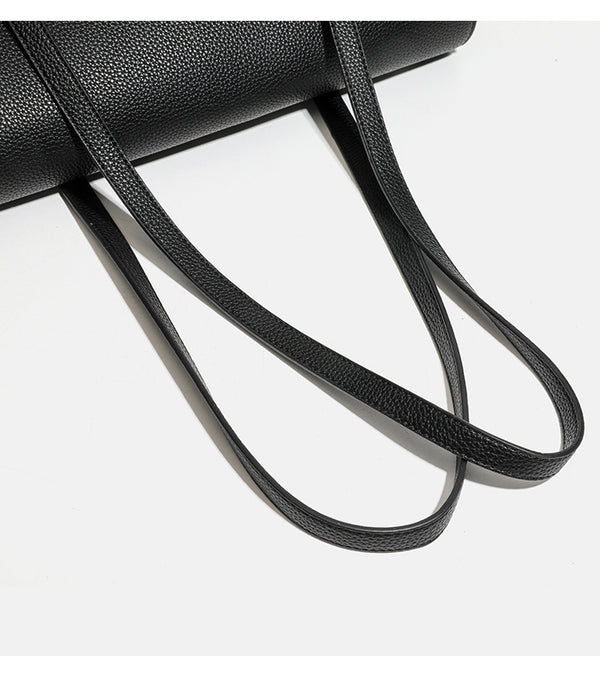 Structured black pebbled-finish flap tote bag with silver turn-lock clasp and long double shoulder straps, detail view 13