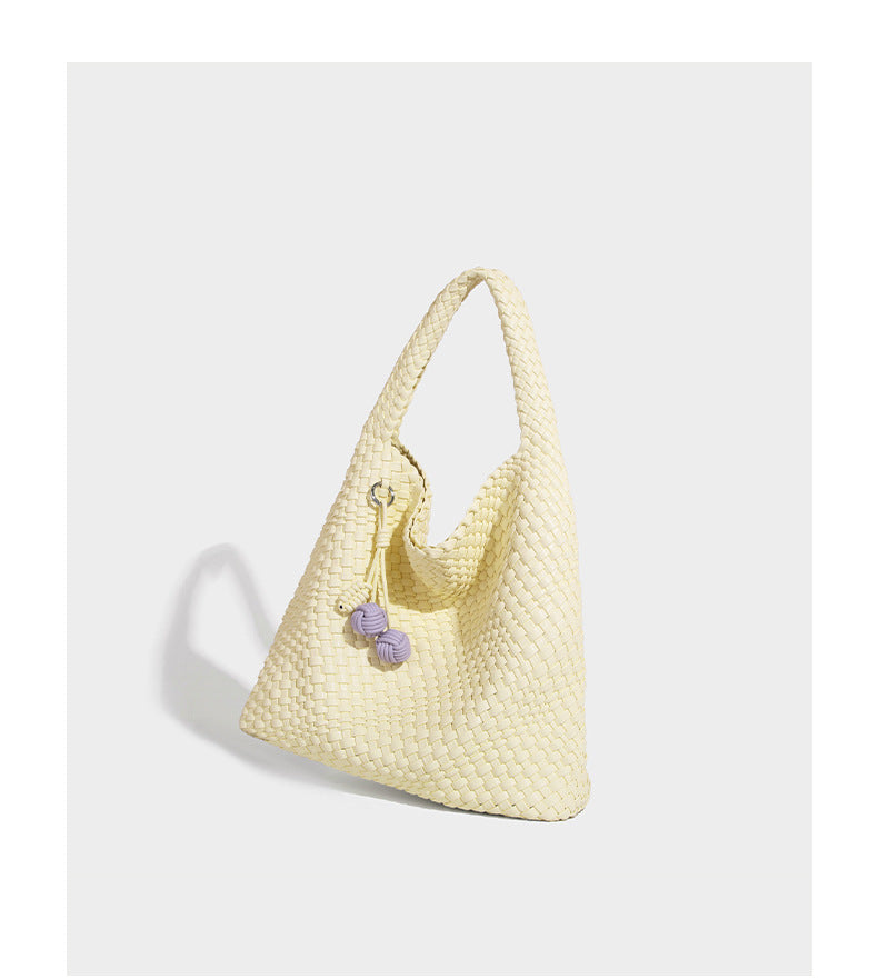Soft hand-woven slouchy hobo tote bag with knotted tassel charm and single looped shoulder strap, detail view 25