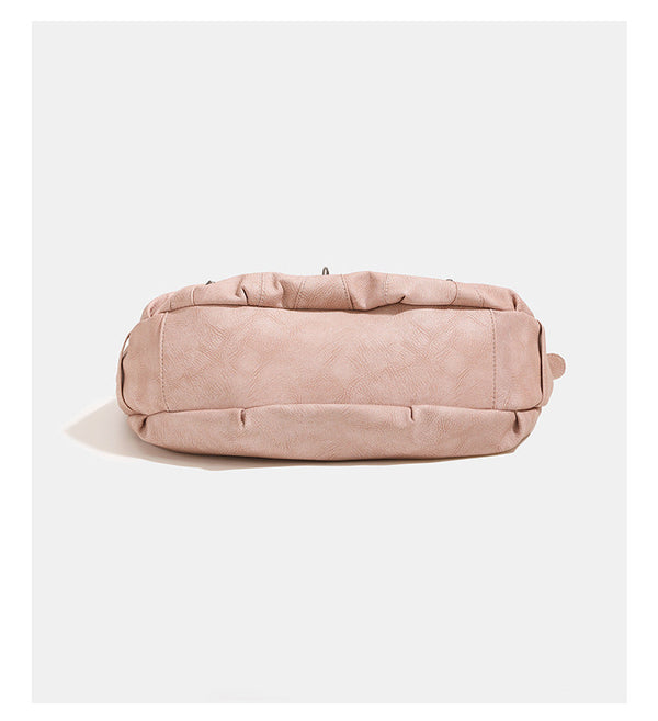 Crescent hobo shoulder bag in matte leather-look finish with star stud front panel, antique-silver hook hardware, and, detail