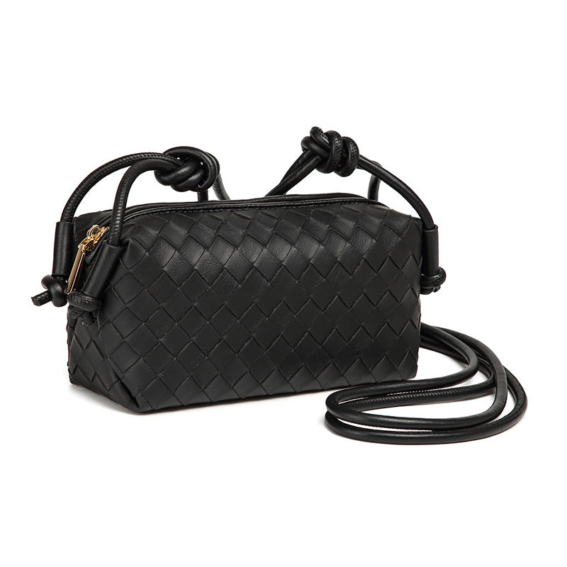 Small rectangular woven-texture mini crossbody bag with knotted rope strap and gold-tone zip closure, detail view 3
