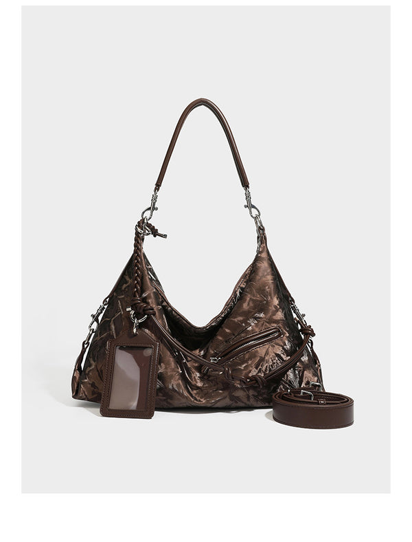 Slouchy hobo shoulder bag in crinkled metallic brown leather-look finish with braided rope knots, silver-tone hardware