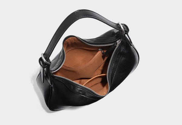 Crescent half-moon shoulder bag in pebbled leather-look finish with adjustable strap and silver-tone hardware, detail view 28
