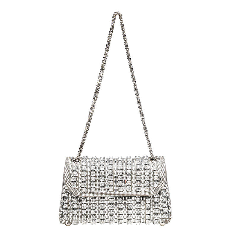 Structured mini flap crossbody bag covered in grid-set rhinestones with silver-tone chain strap, detail view 2