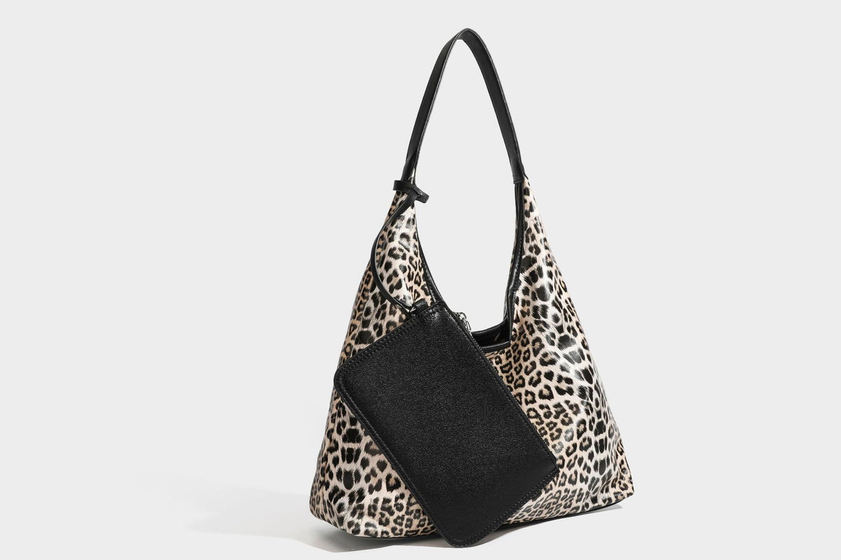 Glossy leopard-print slouchy shoulder bag with long strap and detachable tan zip pouch, detail view 38