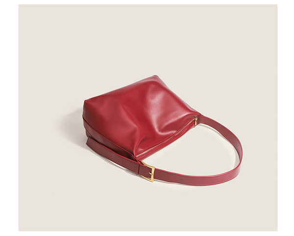 Large slouchy hobo shoulder bag in smooth leather-look finish with single long strap and gold-tone zip closure, detail view