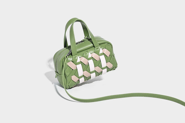 Small structured satchel bag with two-tone woven front panel, dual top handles, and detachable crossbody strap in tan brown