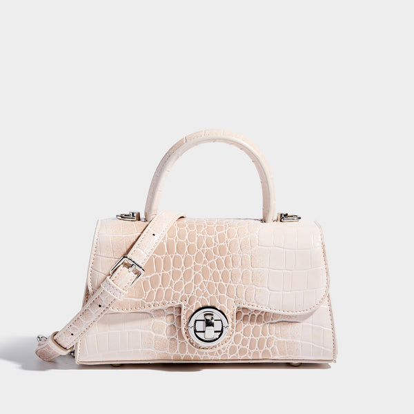Mini croc-embossed glossy structured handbag with silver-tone turn-lock clasp and short top handle, detail view 9