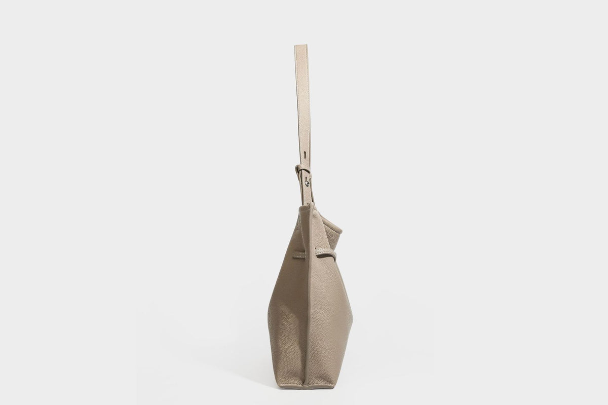 Pebbled leather-look tote bag with front toggle hardware and long shoulder strap, detail view 21