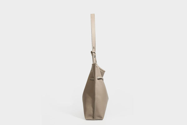 Pebbled leather-look tote bag with front toggle hardware and long shoulder strap, detail view 21