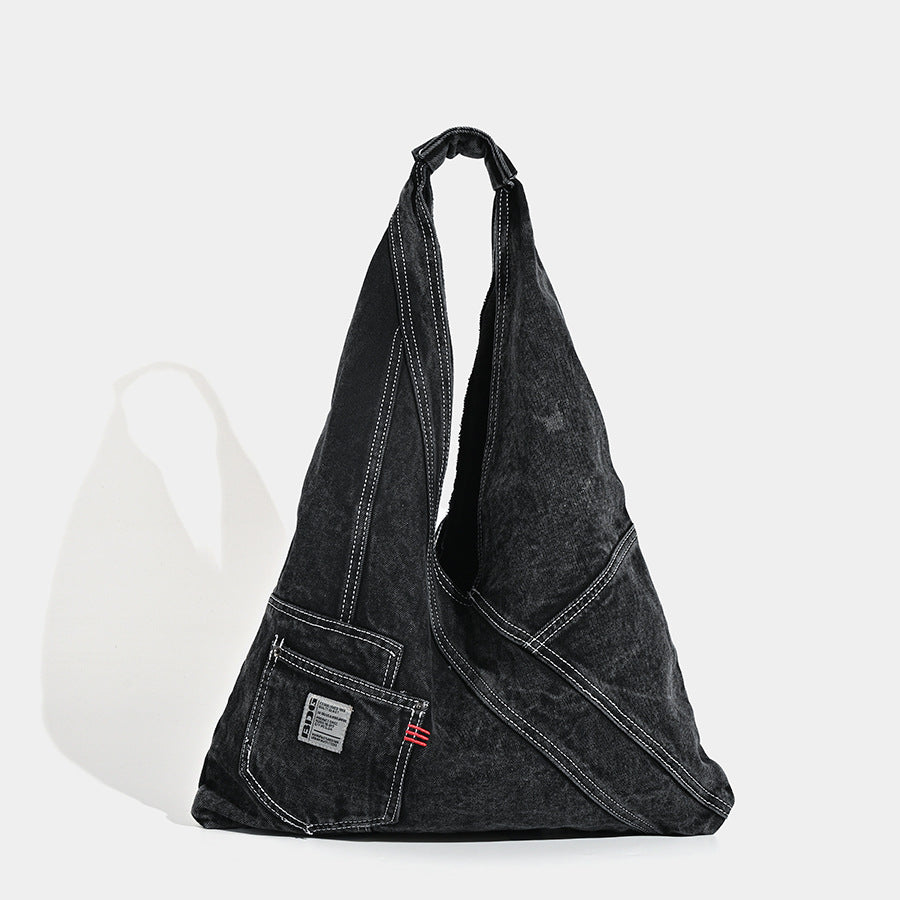 Washed denim slouch tote bag with patch pocket and contrast stitching, detail view 7
