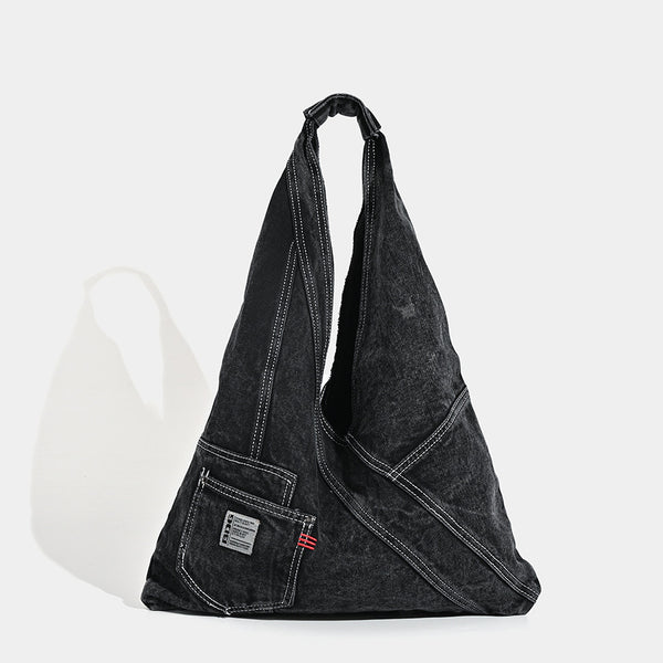 Washed denim slouch tote bag with patch pocket and contrast stitching, detail view 7
