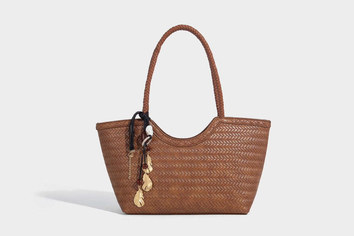 Large open-top woven tote bag with contrasting braided double handles and matching drawstring pouch, detail view 27