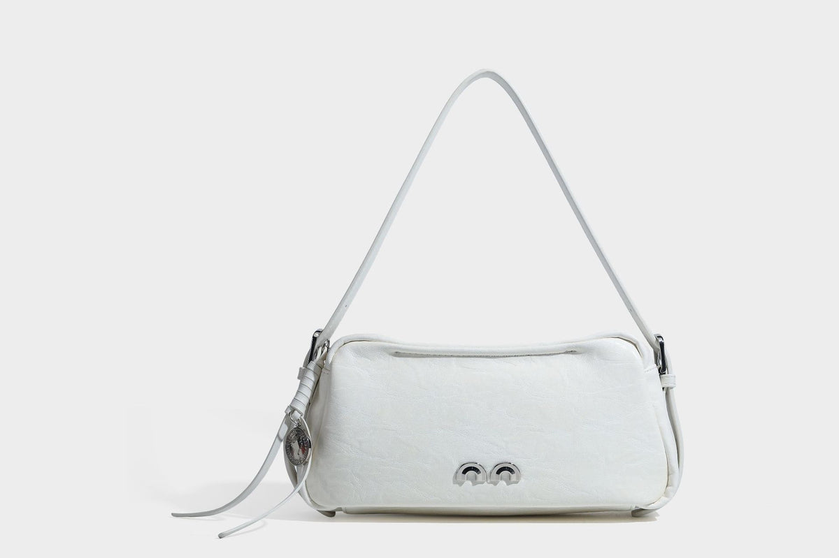 Compact black crinkled leather-look baguette shoulder bag with gold-tone arch hardware and adjustable strap, detail view 21