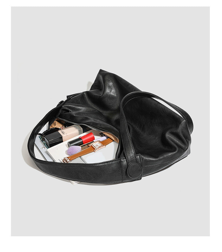 Slouchy leather-look hobo shoulder bag with top zipper and silver-tone hardware, detail view 26