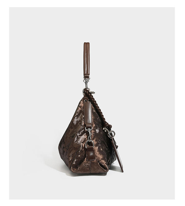 Slouchy hobo shoulder bag in crinkled metallic brown leather-look finish with braided rope knots, silver-tone hardware