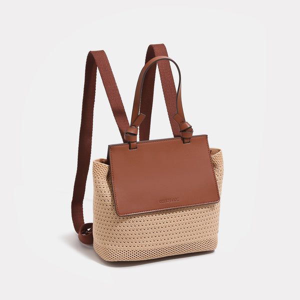 Structured woven tote bag with smooth leather-look front flap panel, knotted top handles, and detachable crossbody strap