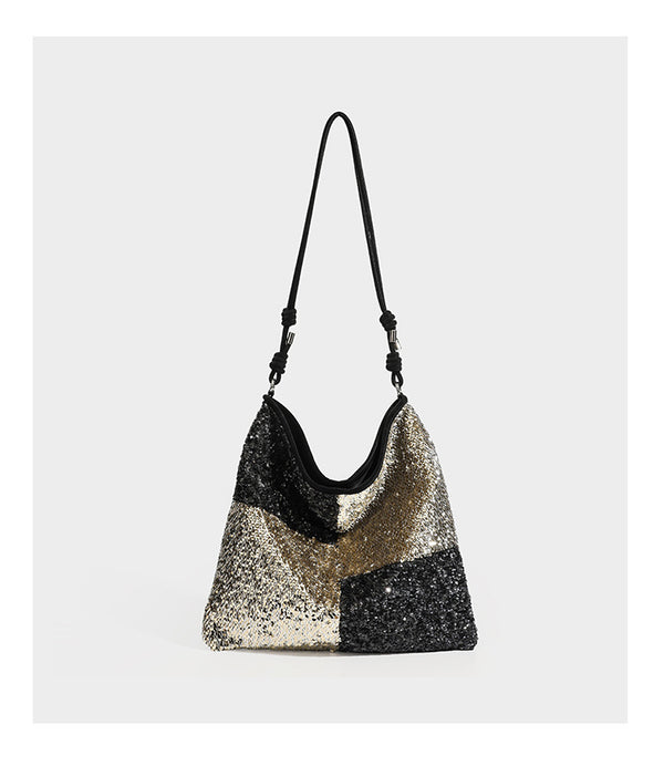 Slouchy hobo shoulder bag with black bugle-bead sequin and cream bouclé patchwork panels, adjustable cream leather-look
