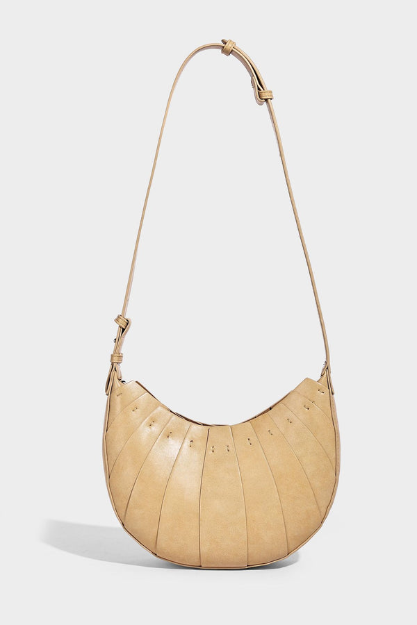 Crescent half-moon shoulder bag with vertical panel seaming, matte-satin leather-look finish, and adjustable gold-tone