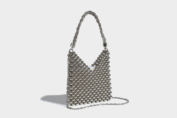 Small silver metallic beaded mini bag with braided rhinestone top handle and detachable chain crossbody strap, detail view 18