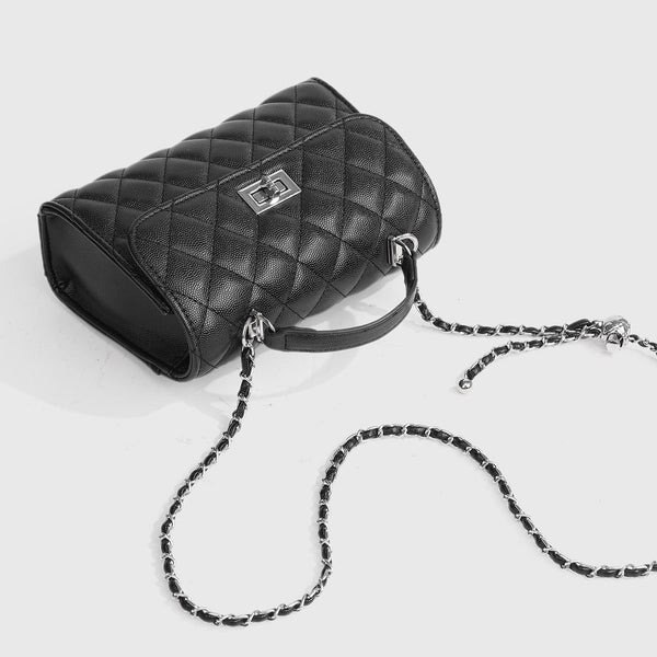 Small structured diamond-quilted flap satchel bag with silver-tone chain strap and turn-lock closure, detail view 4